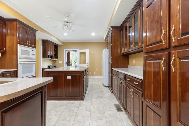 599 Countryside Dr, Loretto, TN 38469 - kitchen featuring white appliances, a ceiling fan, recessed lighting, crown molding, and light countertops