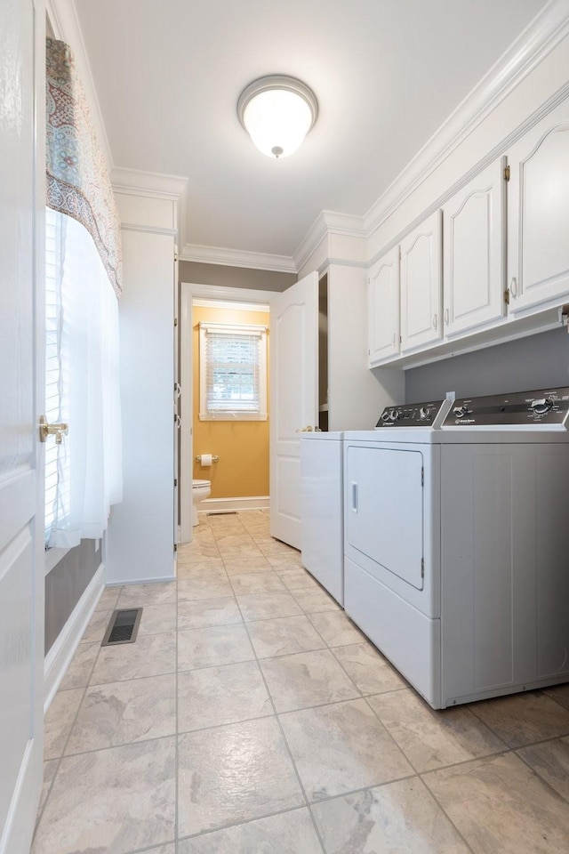599 Countryside Dr, Loretto, TN 38469 - laundry area with washing machine and dryer, cabinet space, and ornamental molding