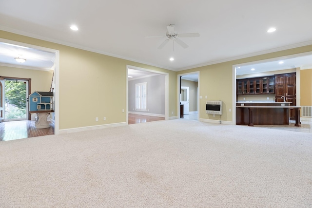 599 Countryside Dr, Loretto, TN 38469 - unfurnished living room featuring heating unit, light colored carpet, ornamental molding, ceiling fan, and recessed lighting