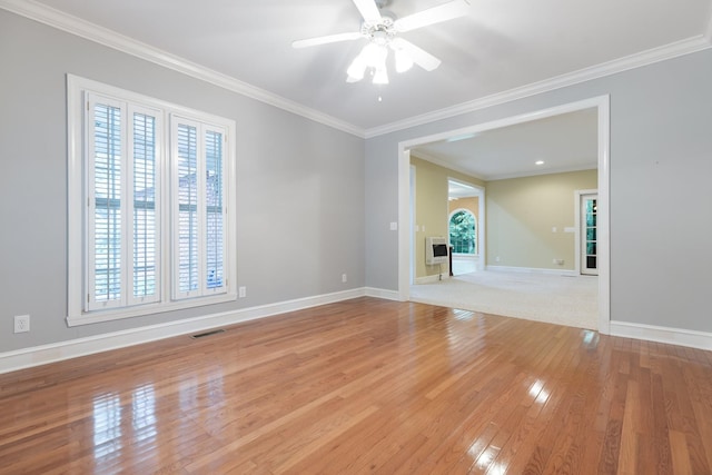 599 Countryside Dr, Loretto, TN 38469 - unfurnished room featuring light wood-type flooring, a ceiling fan, ornamental molding, and heating unit
