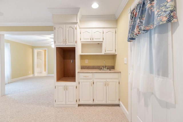 599 Countryside Dr, Loretto, TN 38469 - kitchen featuring light carpet, ornamental molding, white cabinets, and light countertops