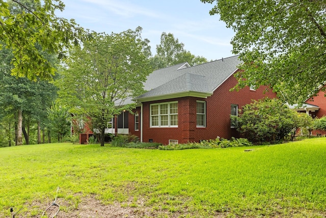 599 Countryside Dr, Loretto, TN 38469 - view of side of home with brick siding, a lawn, and roof with shingles