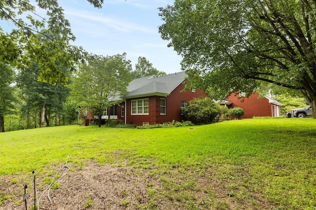 599 Countryside Dr, Loretto, TN 38469 - view of home's exterior featuring a lawn
