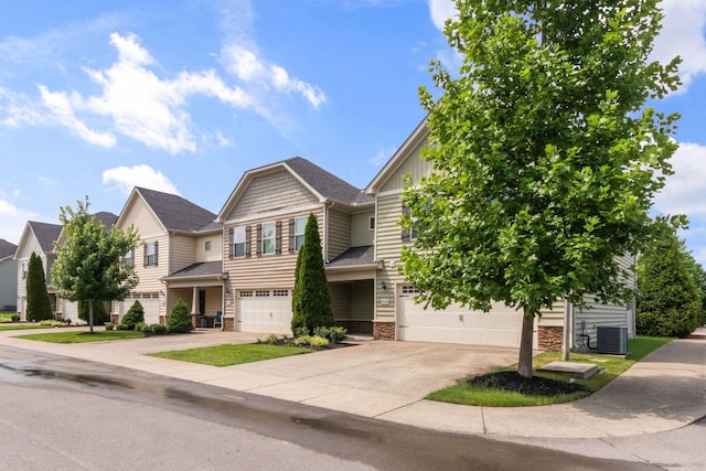 4114 Giacomo Dr, Murfreesboro, TN 37128 - view of front of home with stone siding, concrete driveway, a garage, and board and batten siding