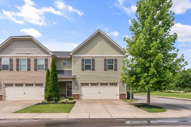 4114 Giacomo Dr, Murfreesboro, TN 37128 - view of front of house featuring stone siding, concrete driveway, and an attached garage