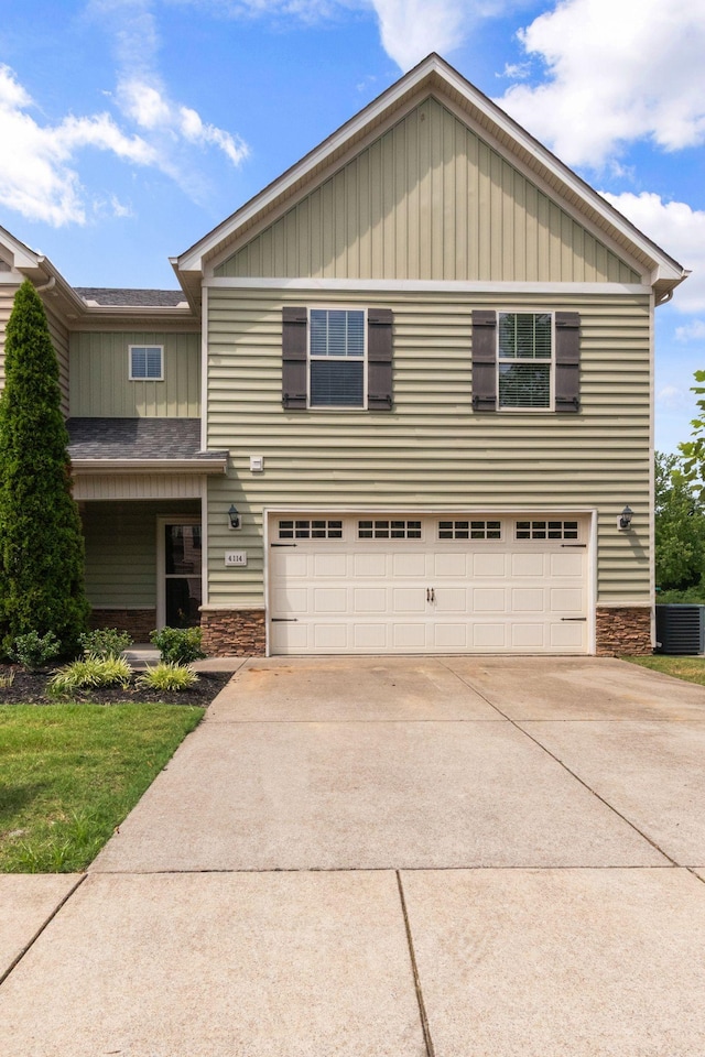 4114 Giacomo Dr, Murfreesboro, TN 37128 - view of front of property with stone siding, concrete driveway, board and batten siding, and a garage