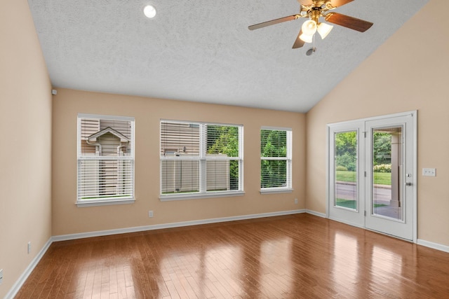 4114 Giacomo Dr, Murfreesboro, TN 37128 - spare room featuring wood finished floors, a textured ceiling, plenty of natural light, a ceiling fan, and lofted ceiling