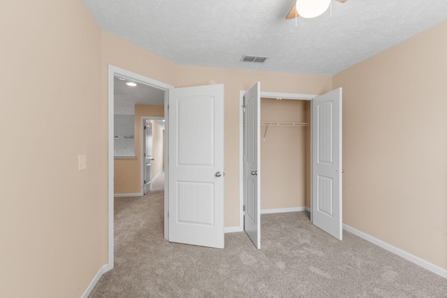 4114 Giacomo Dr, Murfreesboro, TN 37128 - unfurnished bedroom featuring carpet flooring, a textured ceiling, a closet, and a ceiling fan