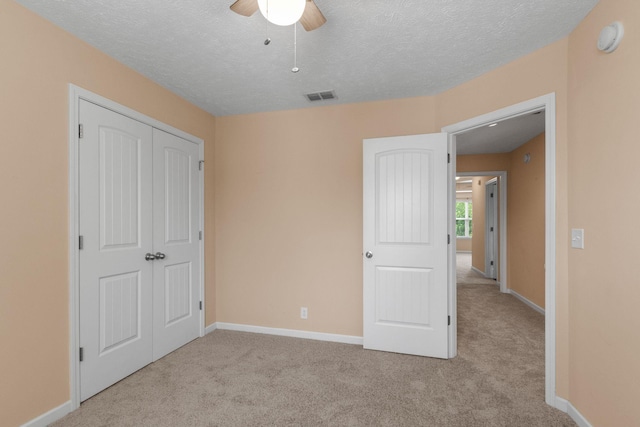 4114 Giacomo Dr, Murfreesboro, TN 37128 - unfurnished bedroom featuring carpet floors, a textured ceiling, a closet, and ceiling fan