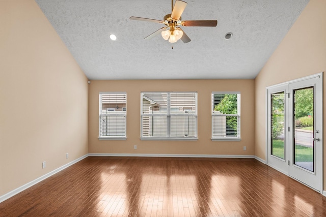 4114 Giacomo Dr, Murfreesboro, TN 37128 - empty room featuring a textured ceiling, vaulted ceiling, wood finished floors, a ceiling fan, and recessed lighting