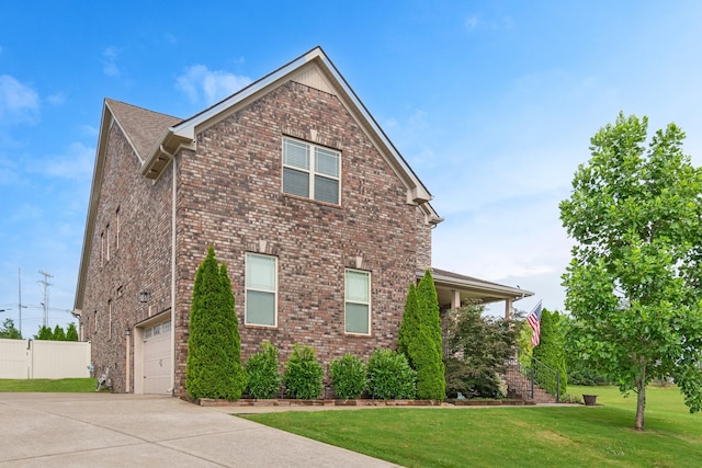 5010 Moretto Ct, Spring Hill, TN 37174 - view of side of property with concrete driveway and brick siding