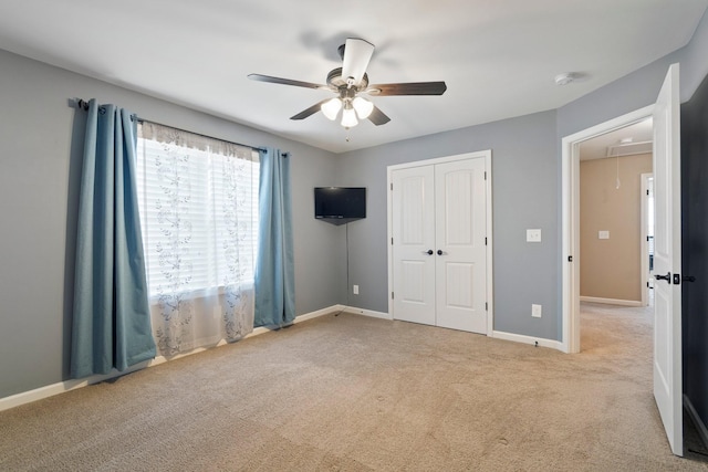 5010 Moretto Ct, Spring Hill, TN 37174 - unfurnished bedroom featuring attic access, carpet, a closet, and a ceiling fan