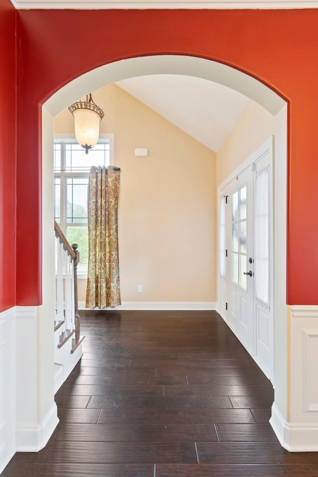5010 Moretto Ct, Spring Hill, TN 37174 - entrance foyer with arched walkways, vaulted ceiling, hardwood / wood-style floors, stairs, and a wainscoted wall