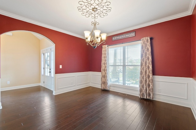 5010 Moretto Ct, Spring Hill, TN 37174 - unfurnished room featuring a chandelier, arched walkways, a wainscoted wall, crown molding, and hardwood / wood-style flooring