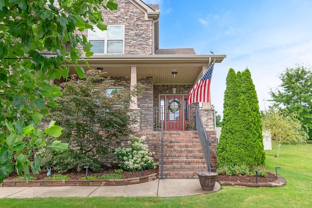 5010 Moretto Ct, Spring Hill, TN 37174 - view of front of house with stone siding, a front yard, and a porch