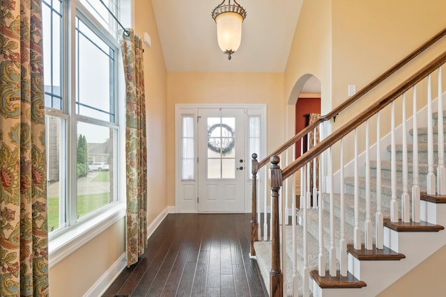 5010 Moretto Ct, Spring Hill, TN 37174 - entryway with plenty of natural light, high vaulted ceiling, arched walkways, dark wood-type flooring, and stairs