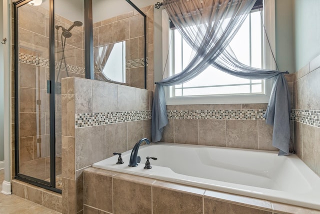 5010 Moretto Ct, Spring Hill, TN 37174 - full bath featuring a stall shower and a garden tub