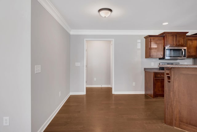 1205 Slaters Creek Rd, Goodlettsville, TN 37072 - kitchen with stainless steel microwave, crown molding, and dark wood-type flooring