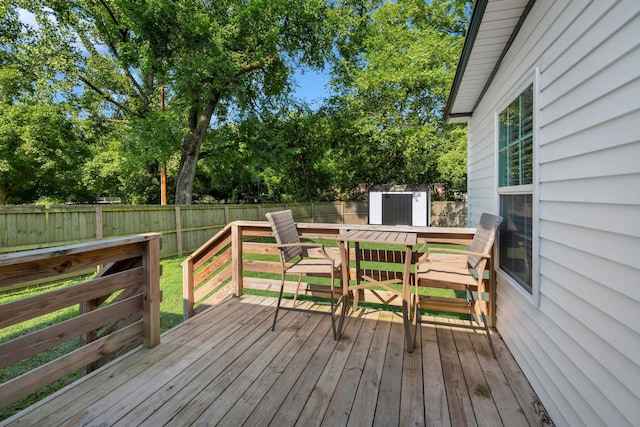 1205 Slaters Creek Rd, Goodlettsville, TN 37072 - wooden deck with outdoor dining area, a fenced backyard, and view of scattered trees