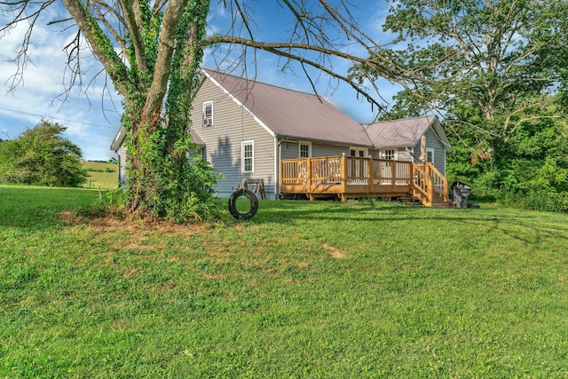 2750 Clampit Hollow Rd, Lafayette, TN 37083 - rear view of property featuring a deck, a yard, and a metal roof