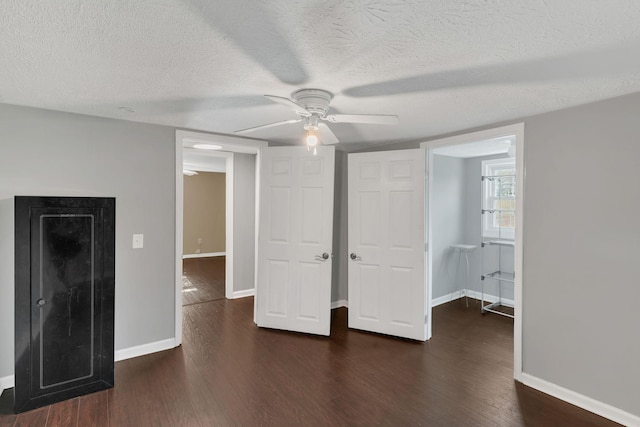 2750 Clampit Hollow Rd, Lafayette, TN 37083 - unfurnished bedroom featuring wood finished floors, a textured ceiling, and ceiling fan
