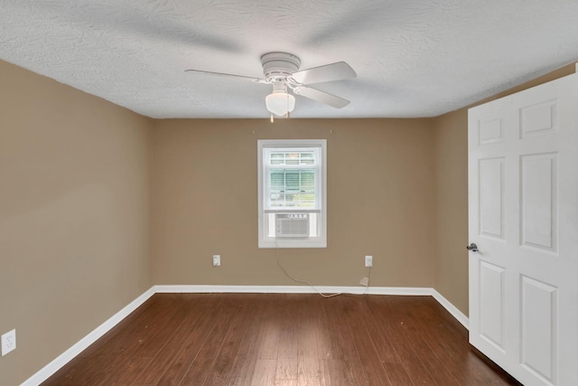 2750 Clampit Hollow Rd, Lafayette, TN 37083 - unfurnished room featuring dark wood-type flooring, a ceiling fan, a textured ceiling, and cooling unit