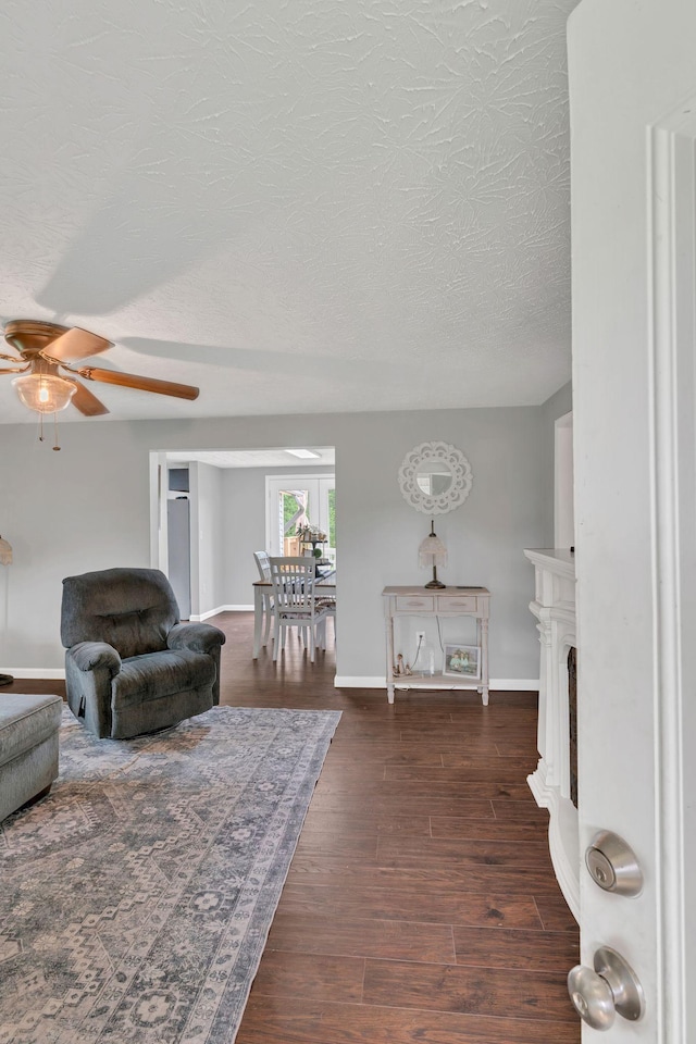 2750 Clampit Hollow Rd, Lafayette, TN 37083 - living room featuring a ceiling fan, a textured ceiling, and wood finished floors