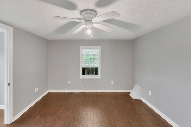 2750 Clampit Hollow Rd, Lafayette, TN 37083 - empty room with dark wood-type flooring, ceiling fan, cooling unit, and a textured ceiling