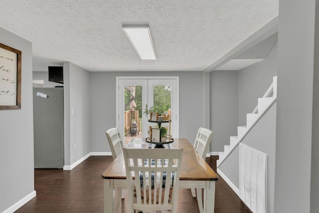 2750 Clampit Hollow Rd, Lafayette, TN 37083 - dining space with a textured ceiling and dark wood-type flooring