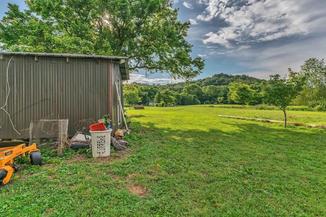 2750 Clampit Hollow Rd, Lafayette, TN 37083 - view of green lawn featuring an outbuilding