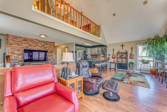 1178 Miracle Rd, Decaturville, TN 38329 - living room featuring high vaulted ceiling and wood finished floors