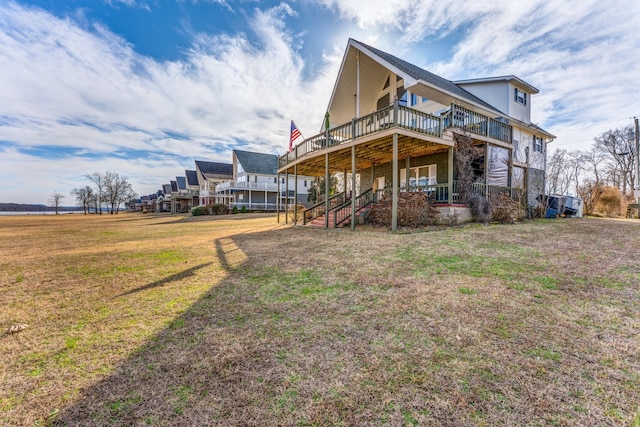 1178 Miracle Rd, Decaturville, TN 38329 - rear view of house with a wooden deck, a lawn, and stairs