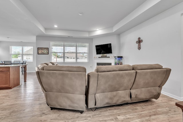 1331 Maize Ln, Lebanon, TN 37087 - living room with a tray ceiling, light wood-style floors, recessed lighting, and a fireplace