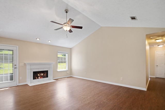 1918 Lawndale Dr, Spring Hill, TN 37174 - unfurnished living room with vaulted ceiling, dark wood-style flooring, ceiling fan, a fireplace, and recessed lighting