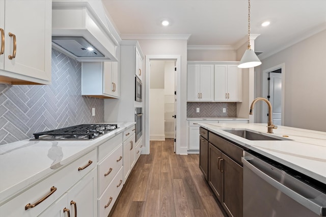 2620 Buckner Ln, Thompsons Station, TN 37179 - kitchen with stainless steel appliances, crown molding, custom exhaust hood, pendant lighting, and tasteful backsplash