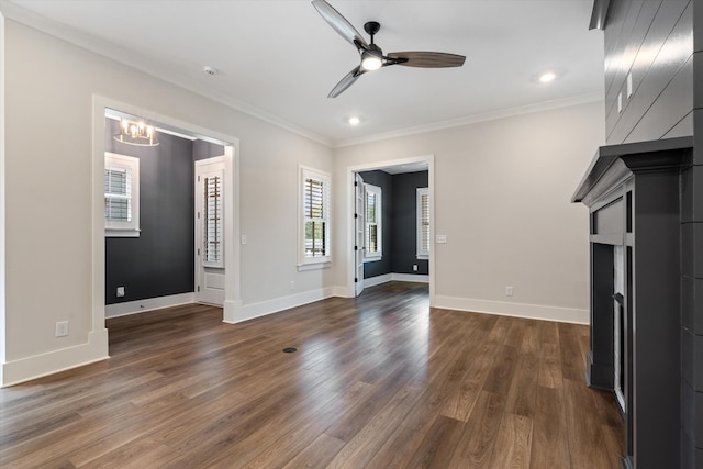 2620 Buckner Ln, Thompsons Station, TN 37179 - unfurnished living room featuring ornamental molding, a ceiling fan, dark wood finished floors, a chandelier, and recessed lighting