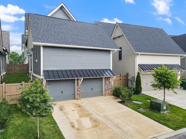 2620 Buckner Ln, Thompsons Station, TN 37179 - view of front facade featuring brick siding, a gate, concrete driveway, and a shingled roof