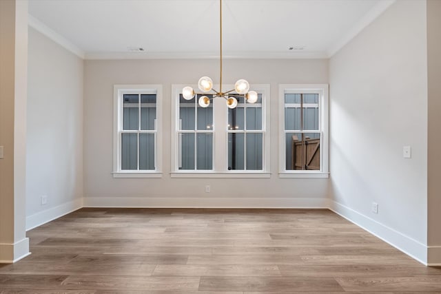 2620 Buckner Ln, Thompsons Station, TN 37179 - unfurnished dining area featuring crown molding, a chandelier, and wood finished floors