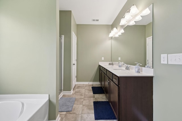 2305 Madeline Ct, Columbia, TN 38401 - full bath with double vanity, a garden tub, and a stall shower