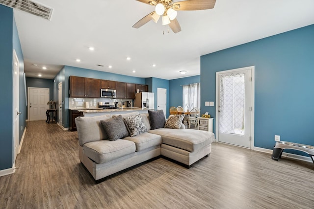 2305 Madeline Ct, Columbia, TN 38401 - living room with wood finished floors, ceiling fan, and recessed lighting
