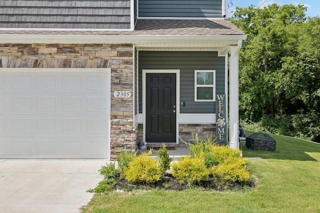 2305 Madeline Ct, Columbia, TN 38401 - property entrance with stone siding, driveway, a yard, and roof with shingles