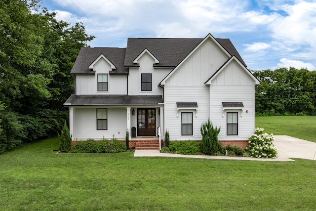 2744 Morrow Ln, Columbia, TN 38401 - modern inspired farmhouse featuring board and batten siding, french doors, a front yard, and covered porch