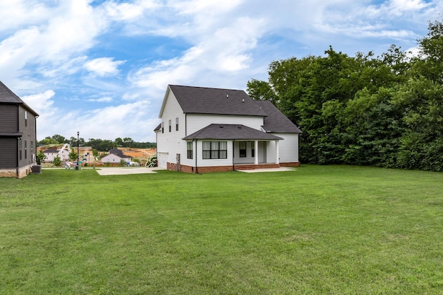2744 Morrow Ln, Columbia, TN 38401 - rear view of house with a shingled roof, a yard, and a patio area