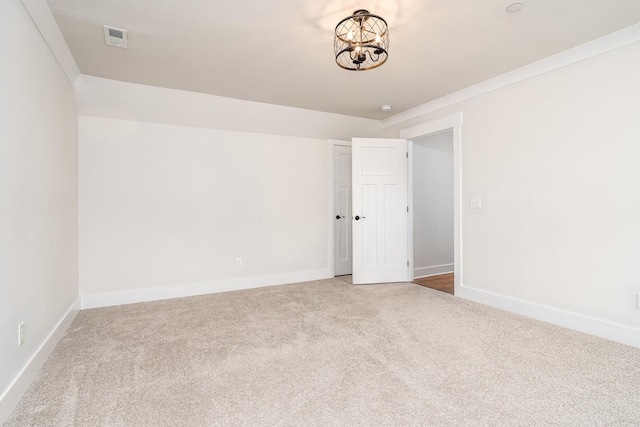 2744 Morrow Ln, Columbia, TN 38401 - carpeted empty room featuring baseboards and a chandelier