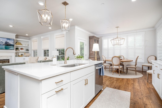 2744 Morrow Ln, Columbia, TN 38401 - kitchen featuring a chandelier, stainless steel dishwasher, ornamental molding, light countertops, and a center island with sink