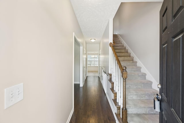 2306 New Holland Cir, Murfreesboro, TN 37128 - entrance foyer with dark wood-style flooring, a textured ceiling, and stairs