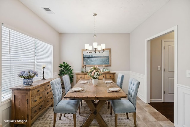 2306 New Holland Cir, Murfreesboro, TN 37128 - dining space with a chandelier, wainscoting, plenty of natural light, and a decorative wall