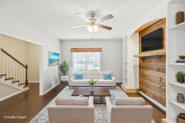 2306 New Holland Cir, Murfreesboro, TN 37128 - living room with dark wood-style floors, a ceiling fan, stairs, and a textured ceiling