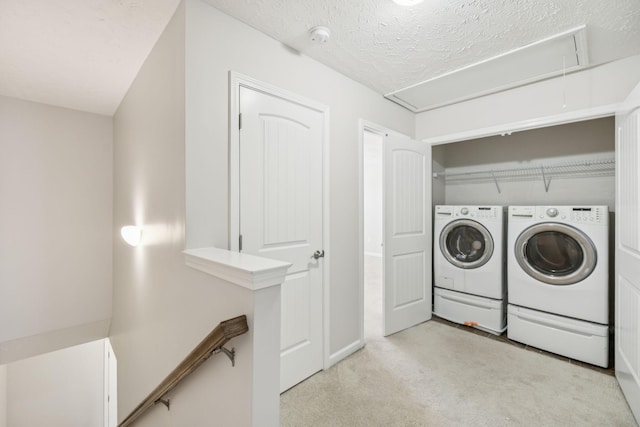 2306 New Holland Cir, Murfreesboro, TN 37128 - washroom with attic access, light carpet, washing machine and dryer, and a textured ceiling