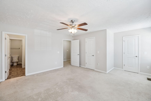 2306 New Holland Cir, Murfreesboro, TN 37128 - unfurnished bedroom with light carpet, connected bathroom, a textured ceiling, and ceiling fan